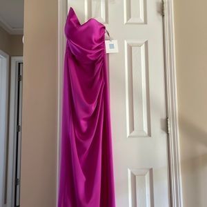 R2 G strapless gown with slit worn once .  Color fuchsia fully lined.